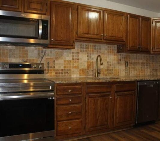homeowner kitchen with brown kitchen cabinets