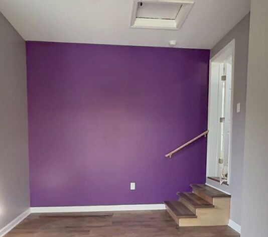 purple wall freshly painted for homeowner after house fire