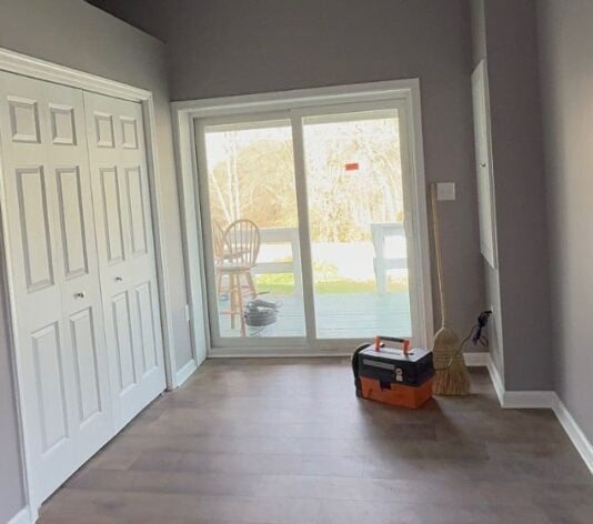 homeowner with freshly painted interior walls