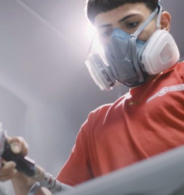 gentleman wearing mask while cabinet refinishing