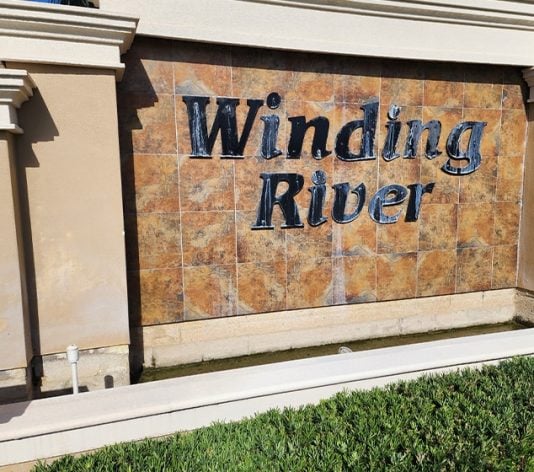close-up of Winding River Community signage freshly painted
