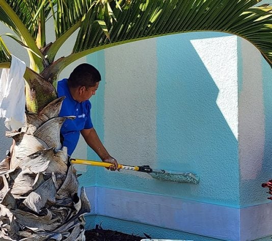 PAINT CORPS&reg; employee painting house
