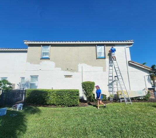 PAINT CORPS&reg; crew painting back of house