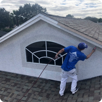 painting contractor painting exterior on roof