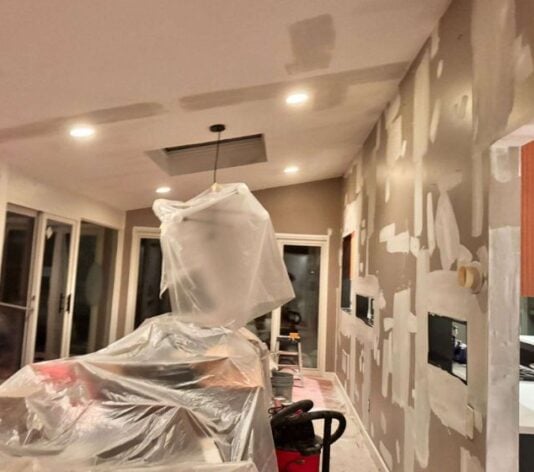 homeowner living room in the process of getting painted