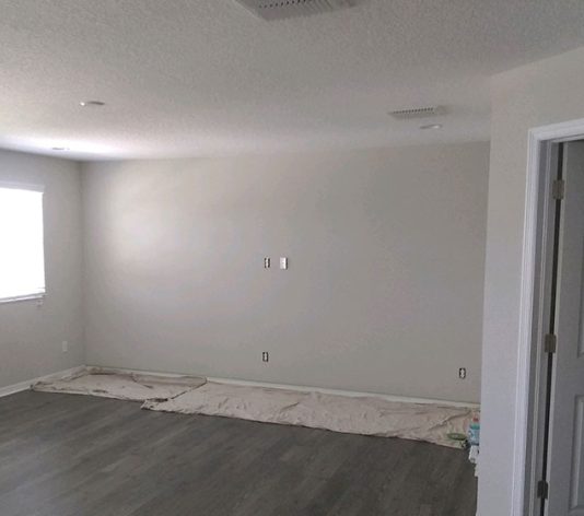 inside of bedroom with grey walls before